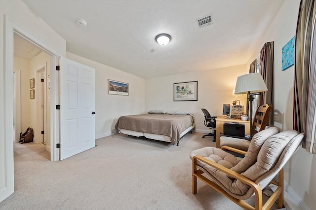 bedroom with baseboards, visible vents, and light colored carpet