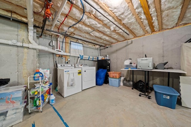 unfinished basement featuring washer and dryer