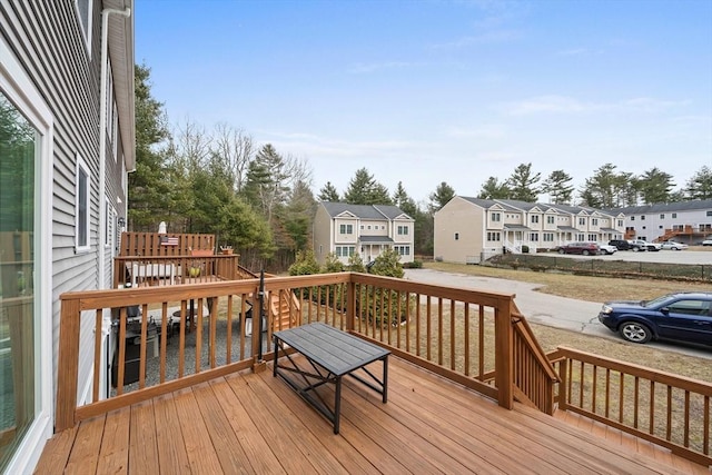 wooden terrace with a residential view