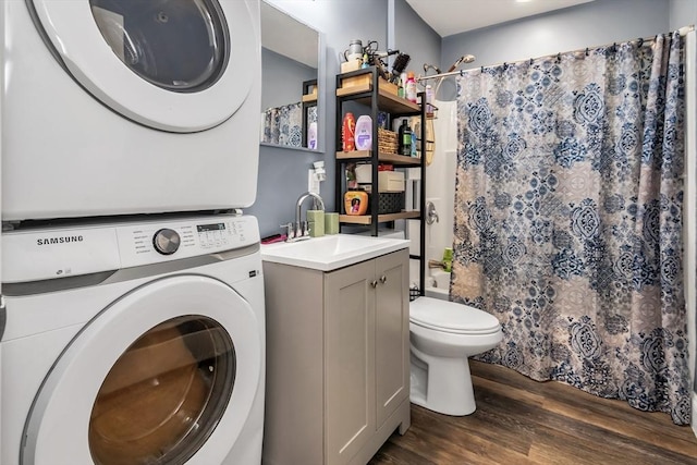 7 S Harlem St, Worcester, MA 01610 - laundry room with stacked washer / dryer and dark wood-style flooring