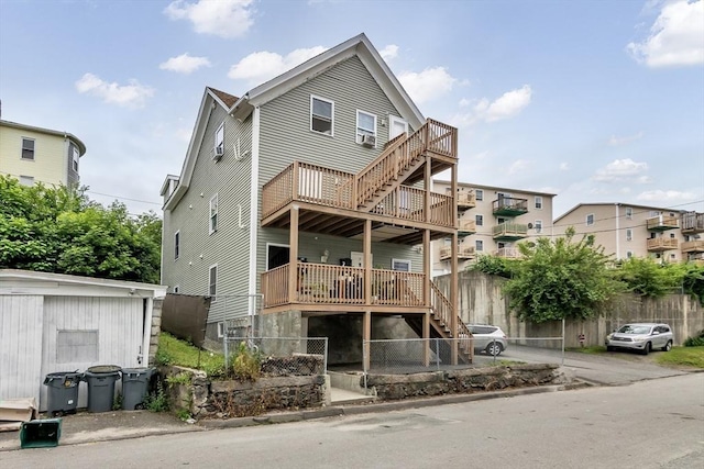 7 S Harlem St, Worcester, MA 01610 - rear view of house with stairs and a wooden deck