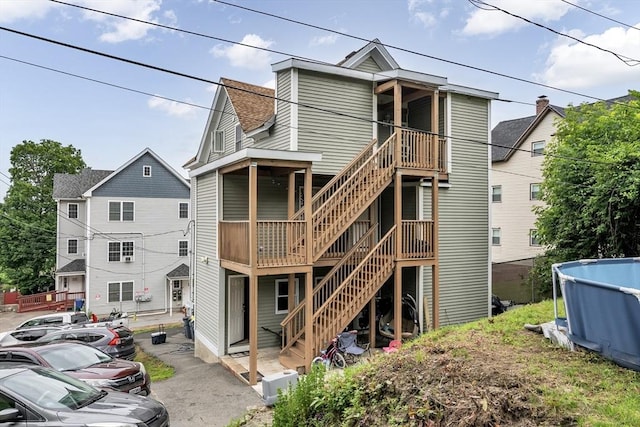 7 S Harlem St, Worcester, MA 01610 - back of house with stairs and a shingled roof