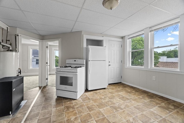 19 Park St, Webster, MA 01570 - kitchen featuring white appliances, gas water heater, a paneled ceiling, and baseboards