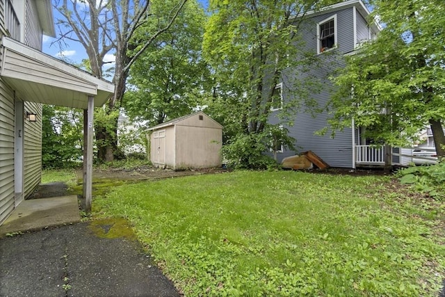 19 Park St, Webster, MA 01570 - view of green lawn with a storage unit and an outdoor structure