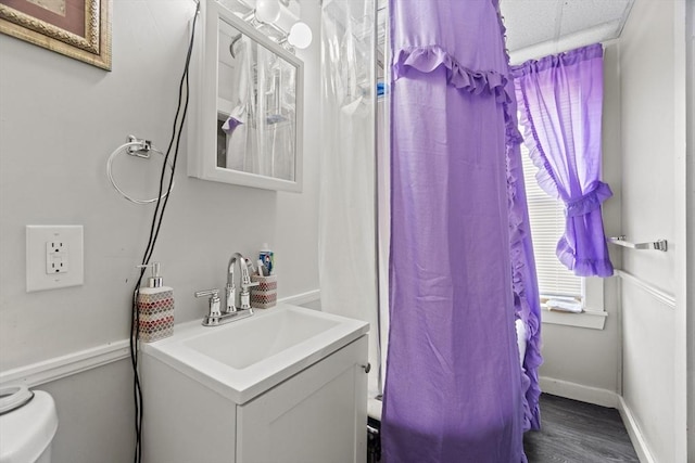 19 Park St, Webster, MA 01570 - bathroom with wood finished floors, vanity, baseboards, and toilet