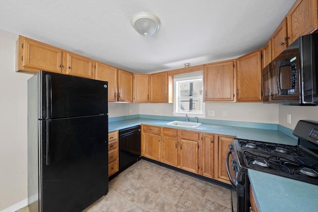 kitchen featuring sink and black appliances