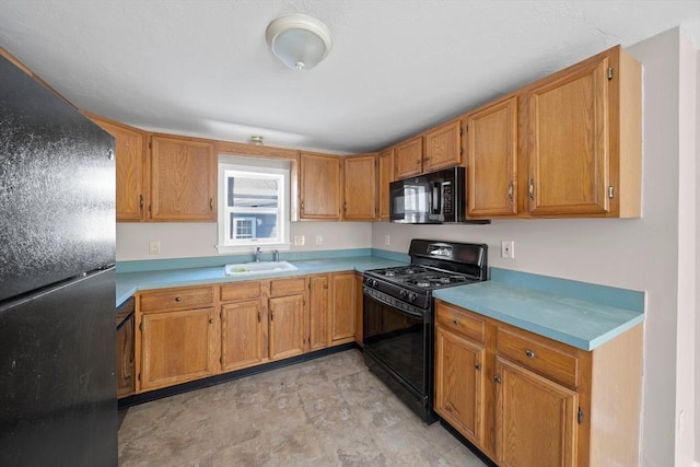 kitchen featuring sink and black appliances