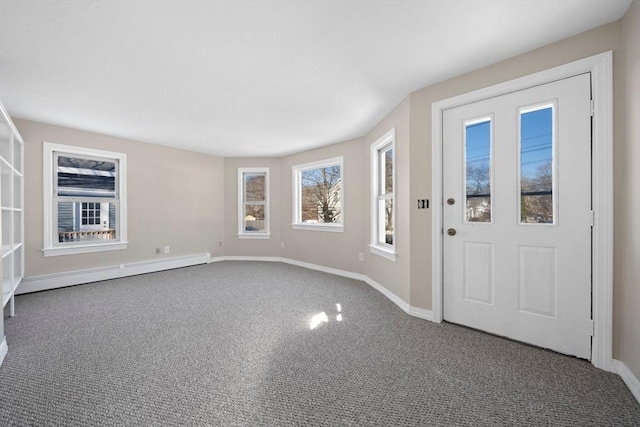 carpeted entrance foyer with a baseboard radiator