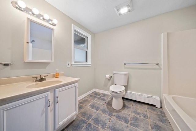 bathroom featuring vanity, a baseboard heating unit, and toilet