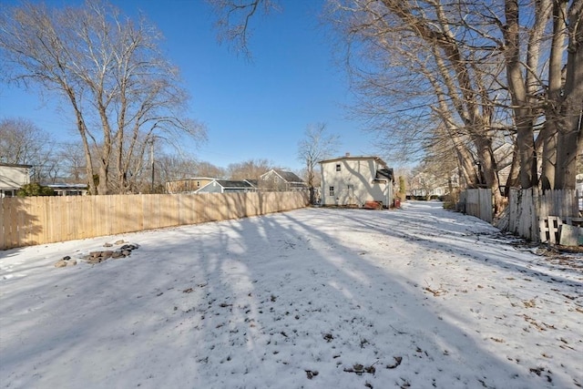 view of yard layered in snow