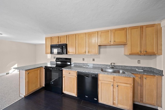 kitchen with light brown cabinetry, sink, dark hardwood / wood-style flooring, kitchen peninsula, and black appliances