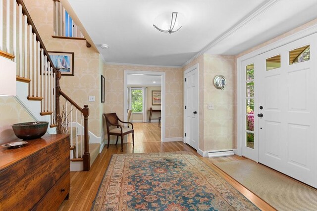 63 Claypit Hill Rd, Wayland, MA 01778 - foyer featuring wallpapered walls, light wood-style floors, baseboards, and stairway