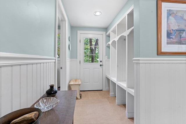 63 Claypit Hill Rd, Wayland, MA 01778 - mudroom with a wainscoted wall and light tile patterned floors