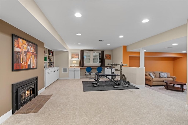 63 Claypit Hill Rd, Wayland, MA 01778 - exercise area featuring light colored carpet, baseboards, recessed lighting, a fireplace with flush hearth, and built in features