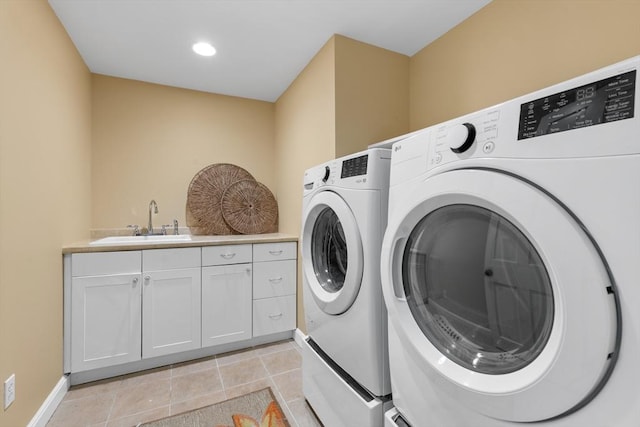 63 Claypit Hill Rd, Wayland, MA 01778 - washroom featuring washer and dryer, cabinet space, baseboards, and light tile patterned flooring