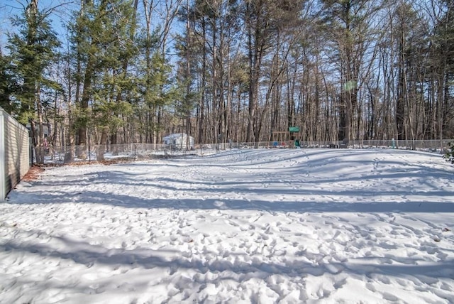 view of yard layered in snow