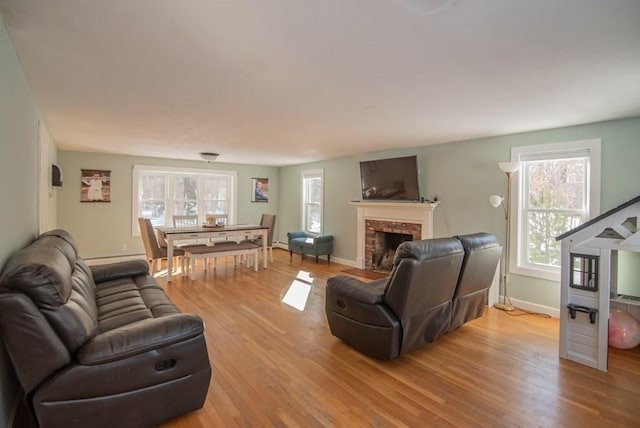 living room with a fireplace and light hardwood / wood-style floors