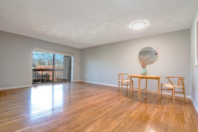 empty room with light hardwood / wood-style flooring