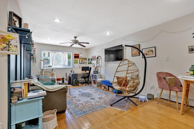 living room with ceiling fan, recessed lighting, and wood finished floors