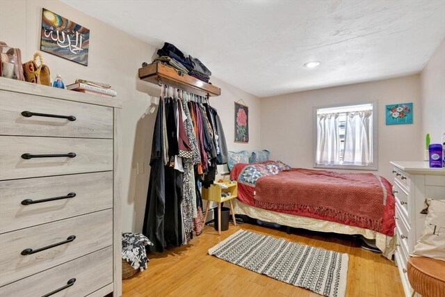 bedroom with light wood-style floors