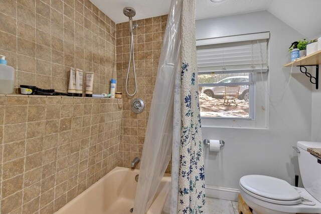 full bathroom with baseboards, shower / tub combo with curtain, tile patterned floors, and toilet
