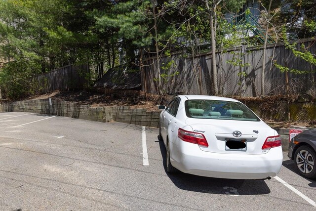 uncovered parking lot with fence