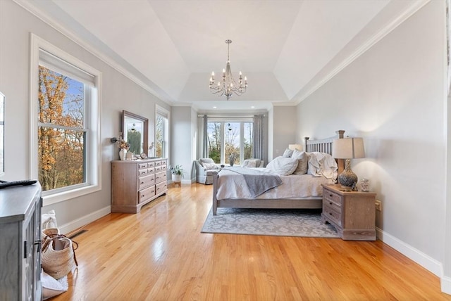 bedroom with an inviting chandelier, baseboards, ornamental molding, and light wood finished floors