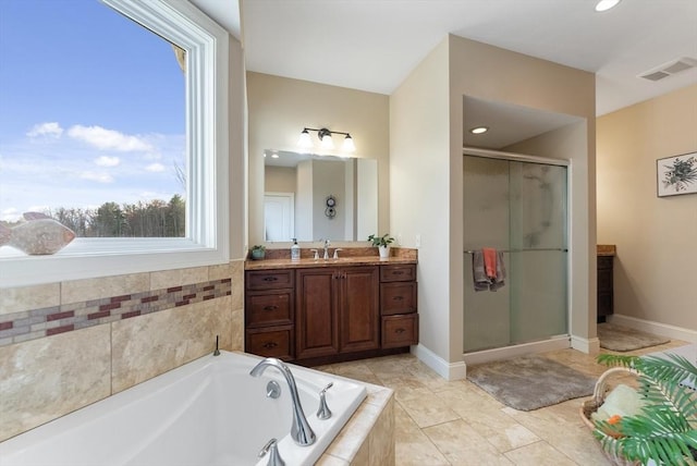 full bathroom featuring vanity, recessed lighting, a shower stall, visible vents, and a garden tub