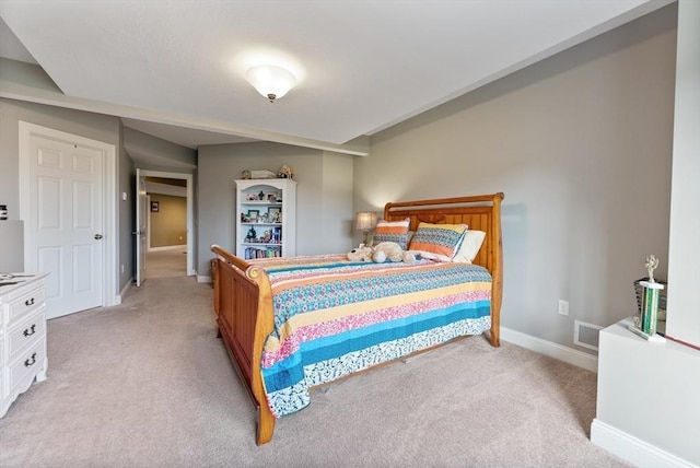 bedroom featuring light colored carpet, baseboards, and visible vents