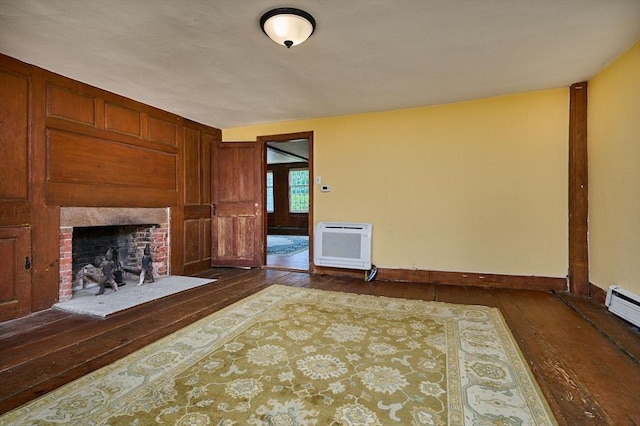 40 Whately Glen Rd, Conway, MA 01341 - unfurnished living room with dark wood-style floors, heating unit, and a fireplace