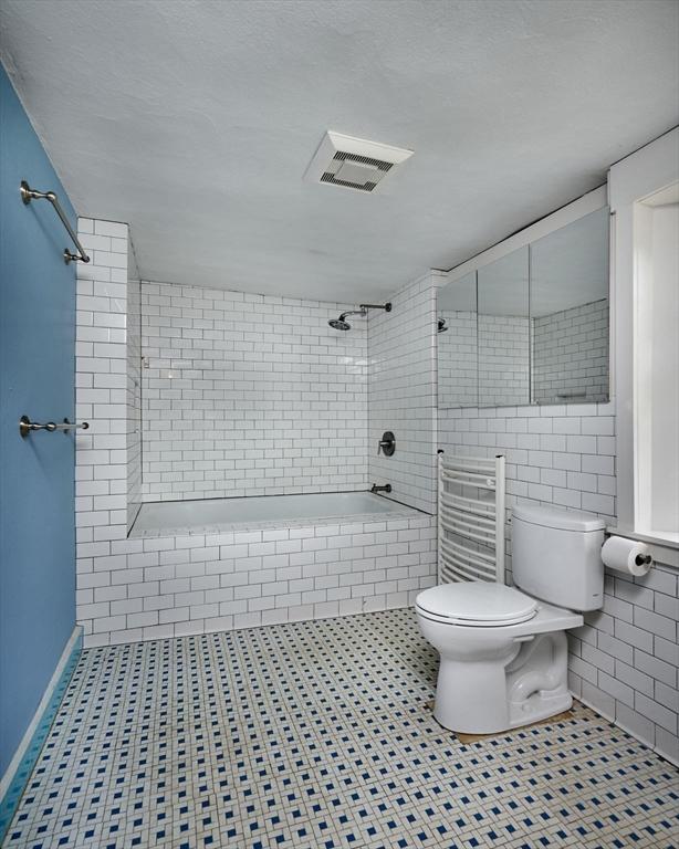 40 Whately Glen Rd, Conway, MA 01341 - full bathroom featuring tile walls, tiled shower / bath combo, and tile patterned flooring