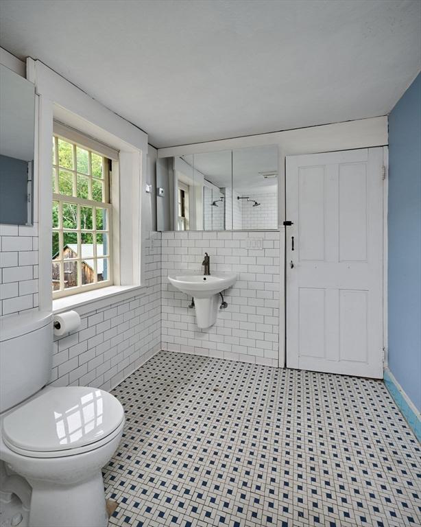 40 Whately Glen Rd, Conway, MA 01341 - bathroom featuring tile walls, tiled shower, and tile patterned flooring