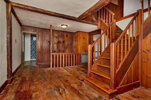 40 Whately Glen Rd, Conway, MA 01341 - stairway featuring hardwood / wood-style flooring, beam ceiling, and wood walls