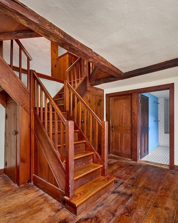 40 Whately Glen Rd, Conway, MA 01341 - staircase with hardwood / wood-style floors, a textured ceiling, and wooden walls