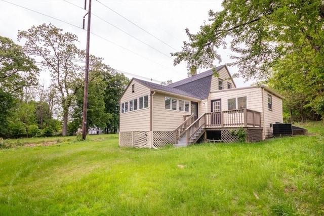 67 Thatcher St, Brockton, MA 02302 - back of property with a deck, stairs, a yard, and roof with shingles