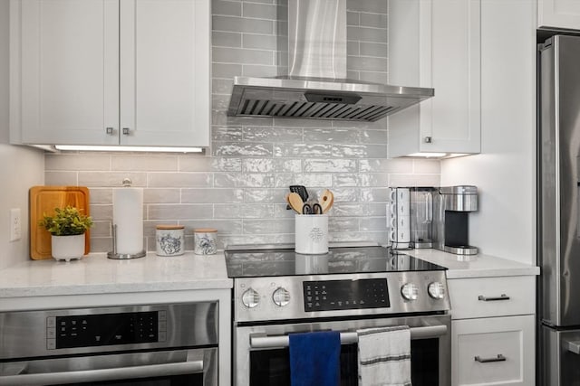 130 Broad Reach Unit 409, Weymouth, MA 02191 - kitchen with stainless steel appliances, wall chimney range hood, and decorative backsplash