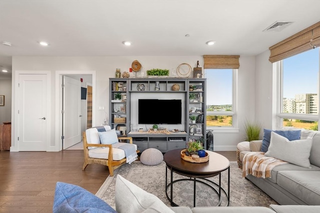 130 Broad Reach Unit 409, Weymouth, MA 02191 - living area featuring wood finished floors, baseboards, and recessed lighting
