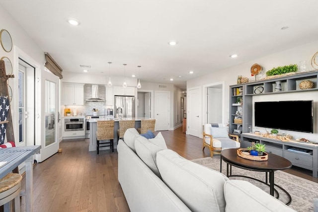 130 Broad Reach Unit 409, Weymouth, MA 02191 - living room with wood finished floors, recessed lighting, and baseboards