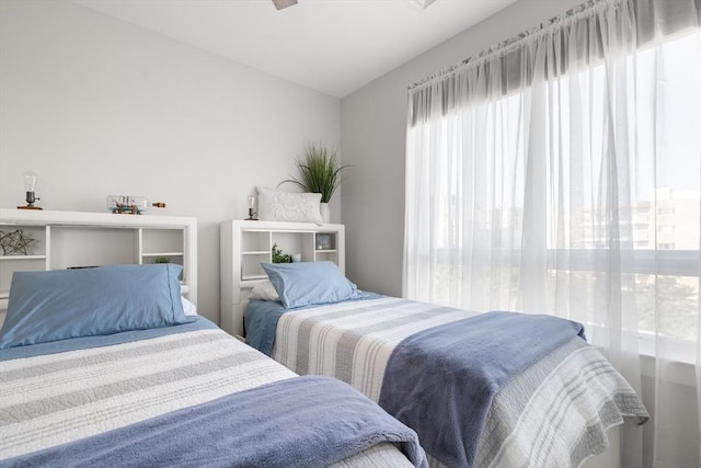 130 Broad Reach Unit 409, Weymouth, MA 02191 - bedroom with multiple windows and lofted ceiling