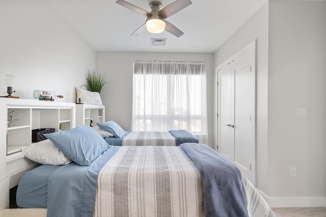 130 Broad Reach Unit 409, Weymouth, MA 02191 - bedroom featuring baseboards, ceiling fan, and wood finished floors