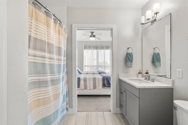 130 Broad Reach Unit 409, Weymouth, MA 02191 - bathroom with a ceiling fan, vanity, toilet, connected bathroom, and curtained shower