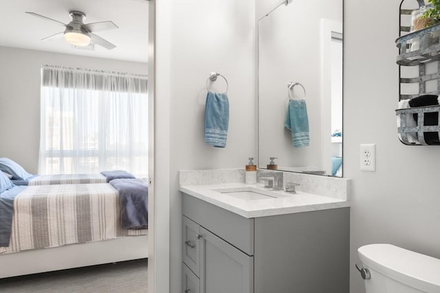 130 Broad Reach Unit 409, Weymouth, MA 02191 - half bath featuring connected bathroom, vanity, toilet, and a ceiling fan