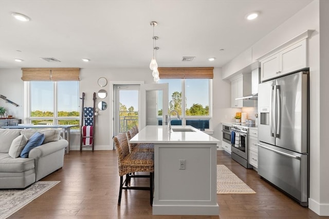 130 Broad Reach Unit 409, Weymouth, MA 02191 - kitchen with stainless steel appliances, a sink, open floor plan, an island with sink, and light countertops