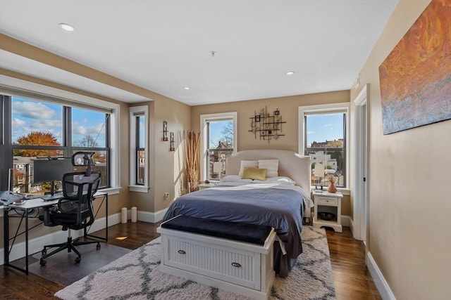 bedroom with recessed lighting, baseboards, and wood finished floors