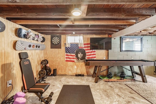 workout room with wood walls