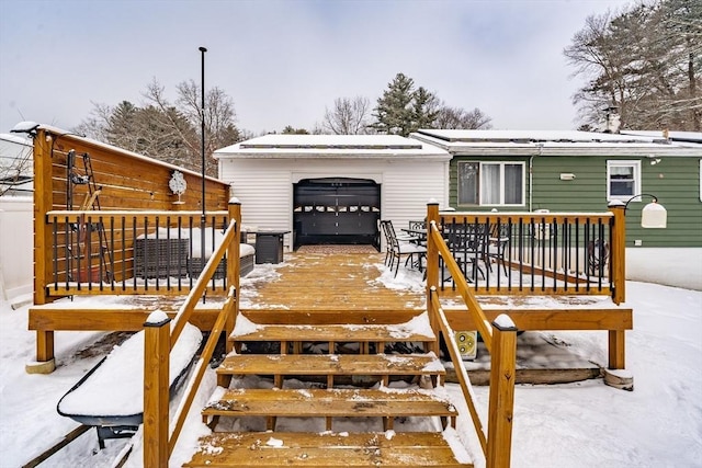 view of snow covered deck