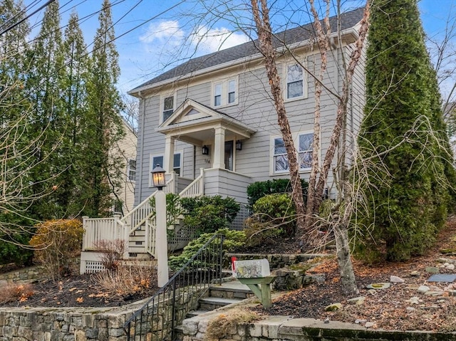 view of front of property with stairs