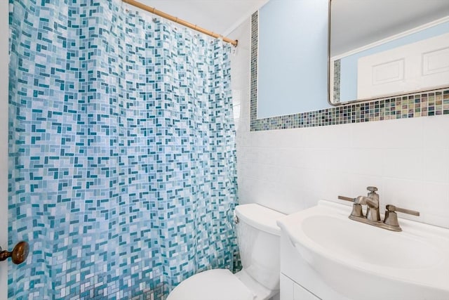127 Short Beach Rd, Barnstable, MA 02632 - bathroom with tile walls, toilet, vanity, and a shower with curtain