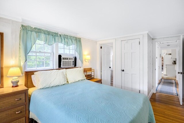 127 Short Beach Rd, Barnstable, MA 02632 - bedroom featuring wood finished floors, crown molding, a closet, and cooling unit