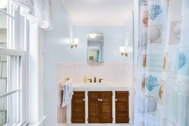 127 Short Beach Rd, Barnstable, MA 02632 - full bathroom featuring ornamental molding, vanity, tile walls, and a shower with shower curtain
